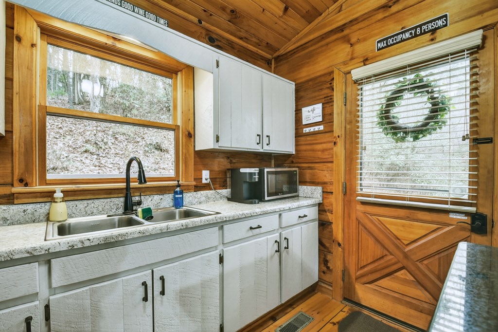488 Joann Sisson Road Blue Ridge, GA 30513 - Photo 24 of 39 a kitchen with a sink and a window
