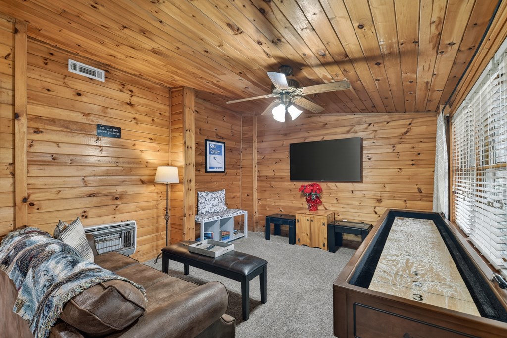 488 Joann Sisson Road Blue Ridge, GA 30513 - Photo 31 of 39 a living room with furniture and a flat screen tv