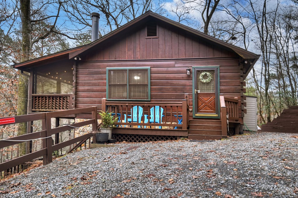 488 Joann Sisson Road Blue Ridge, GA 30513 - Photo 7 of 39 a front view of a house with balcony