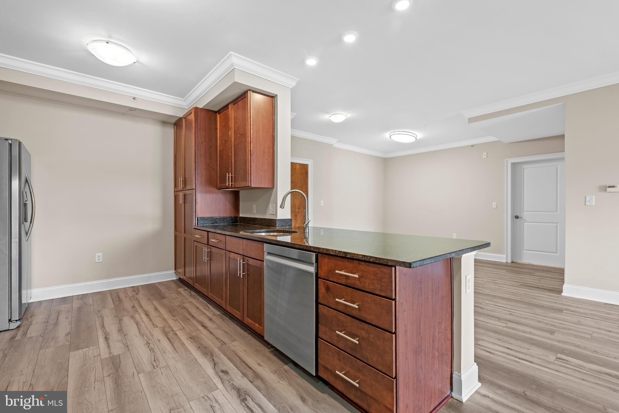 6301 Edsall Road, Unit 424 Alexandria, VA 22312 - Photo 11 of 30 a kitchen with stainless steel appliances granite countertop a stove and a sink