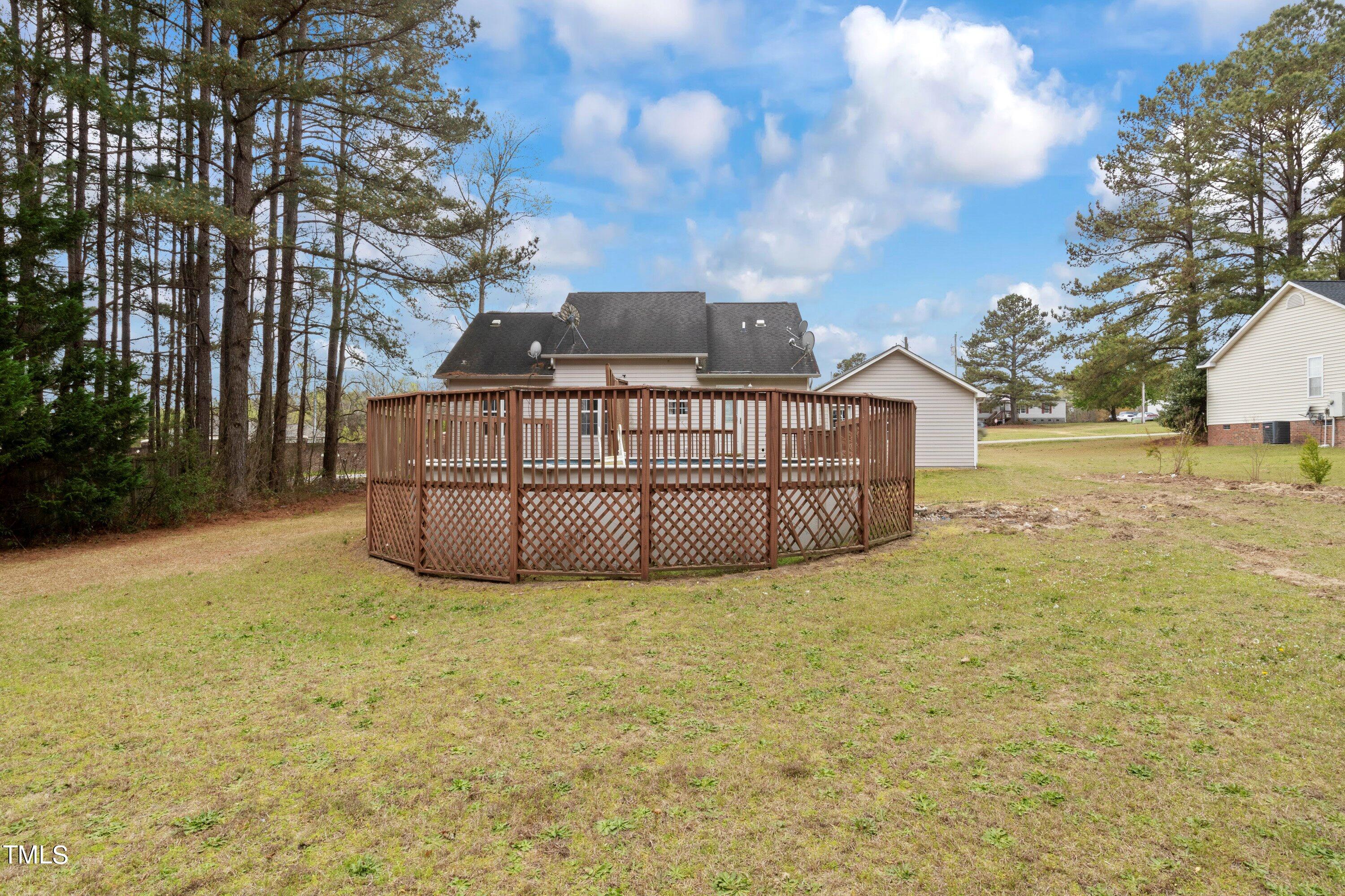 271 Old Fairground Road Willow Spring, NC 27592 - Photo 9 of 11 a view of a house with a yard