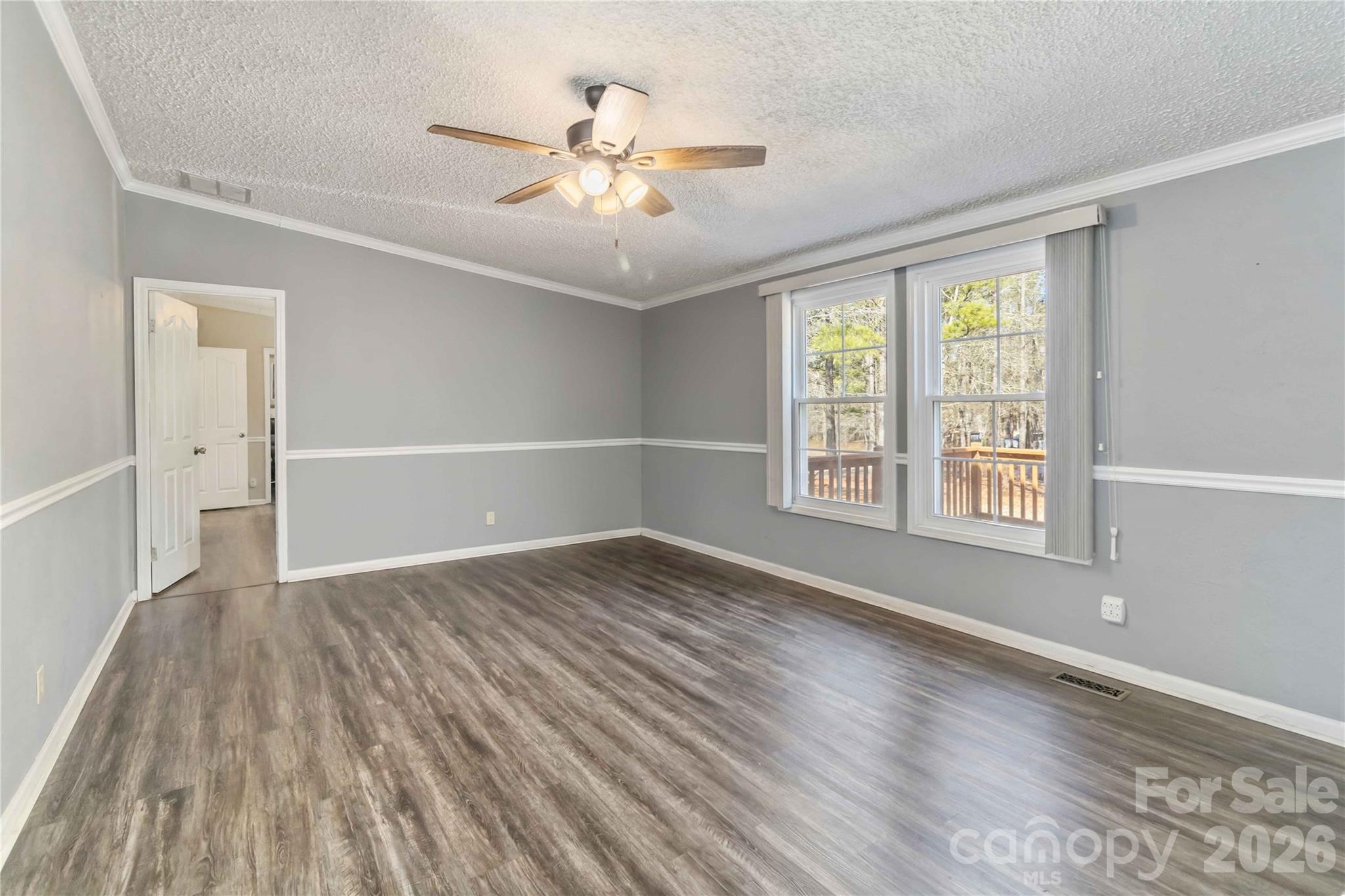 482 Pine Road Jefferson, SC 29718 - Photo 11 of 39 a view of an empty room with wooden floor and a window