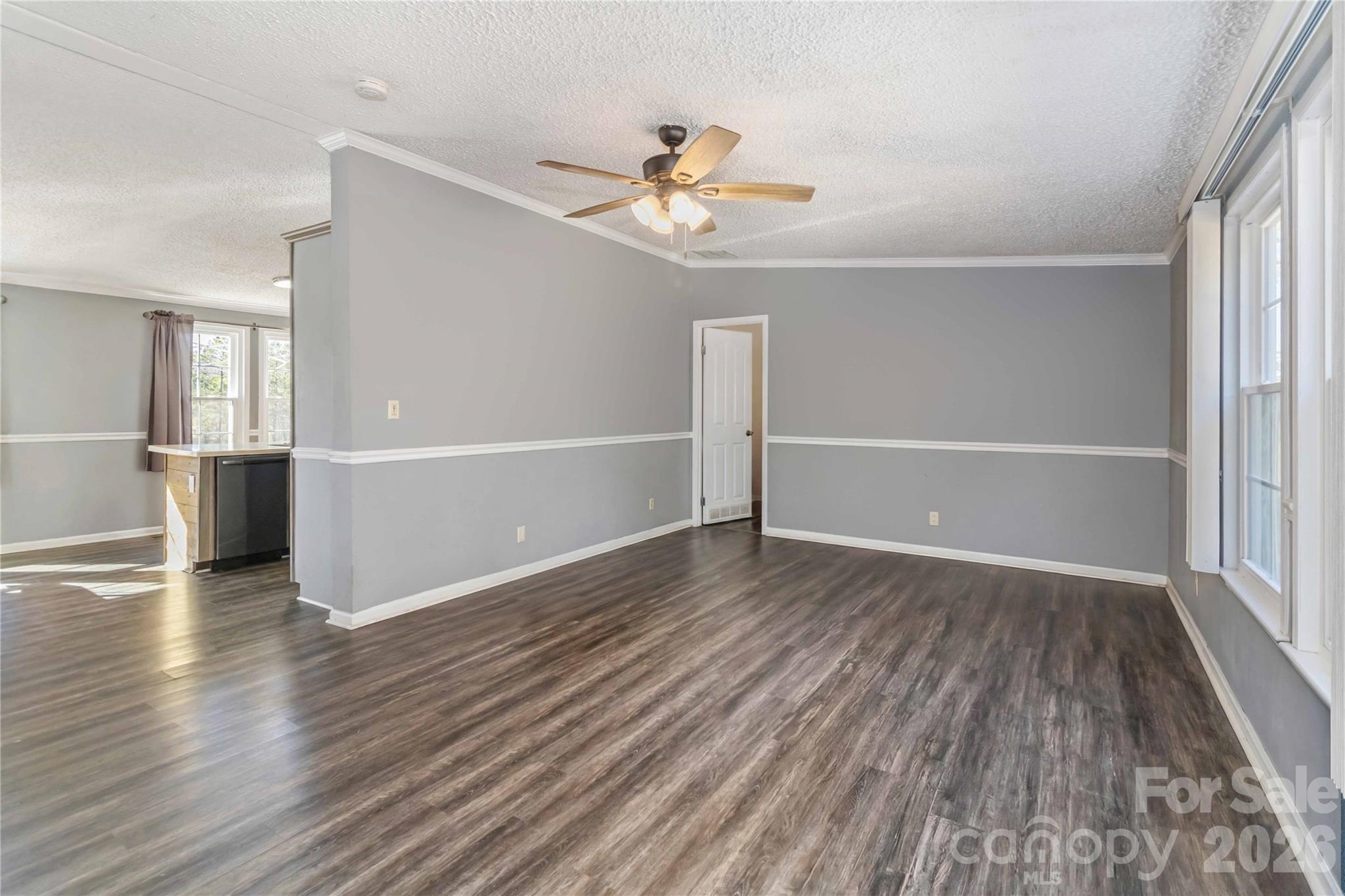 482 Pine Road Jefferson, SC 29718 - Photo 12 of 39 wooden floor in an empty room with a window