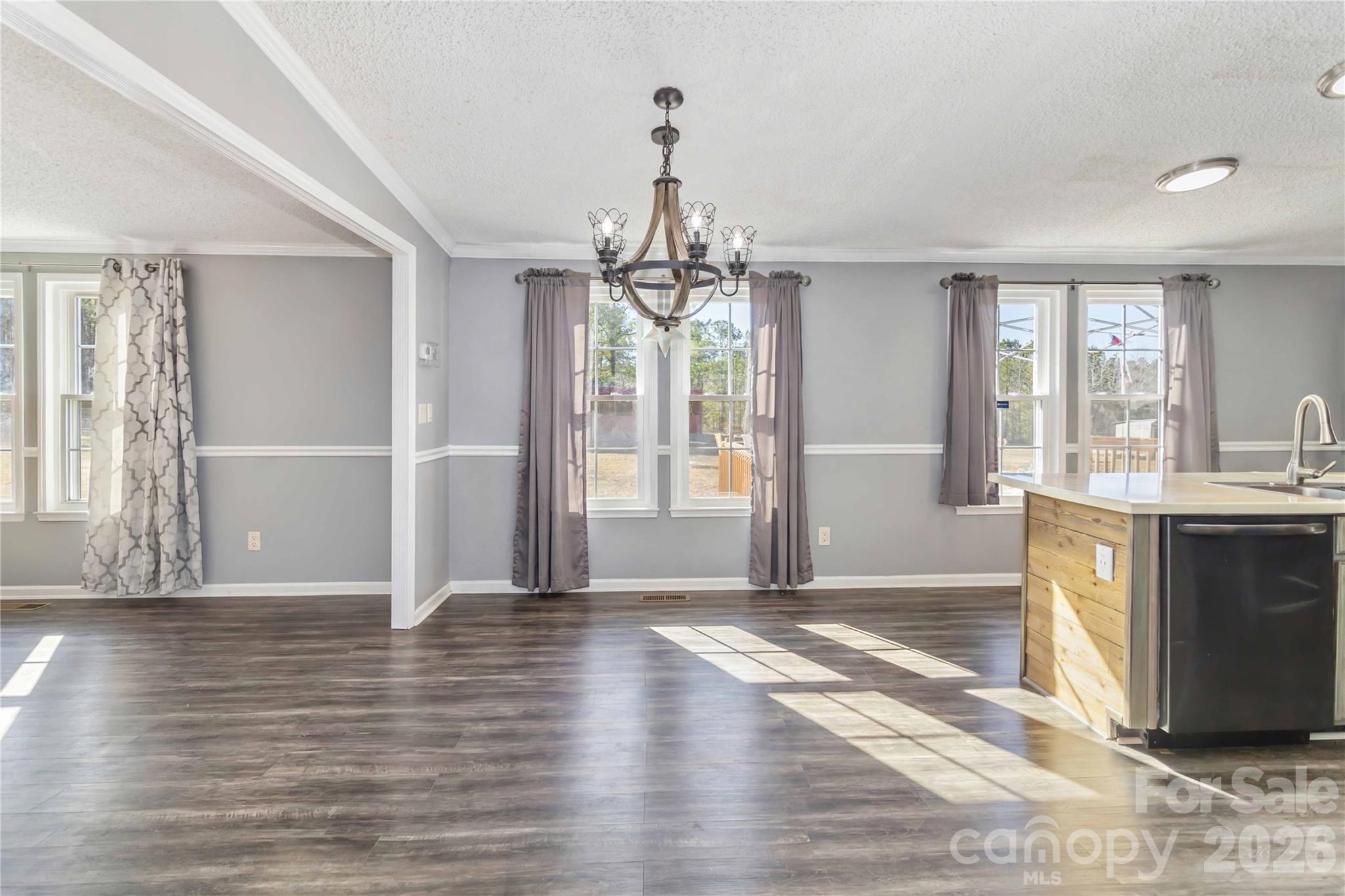 482 Pine Road Jefferson, SC 29718 - Photo 15 of 39 a view of a big room with wooden floor and windows