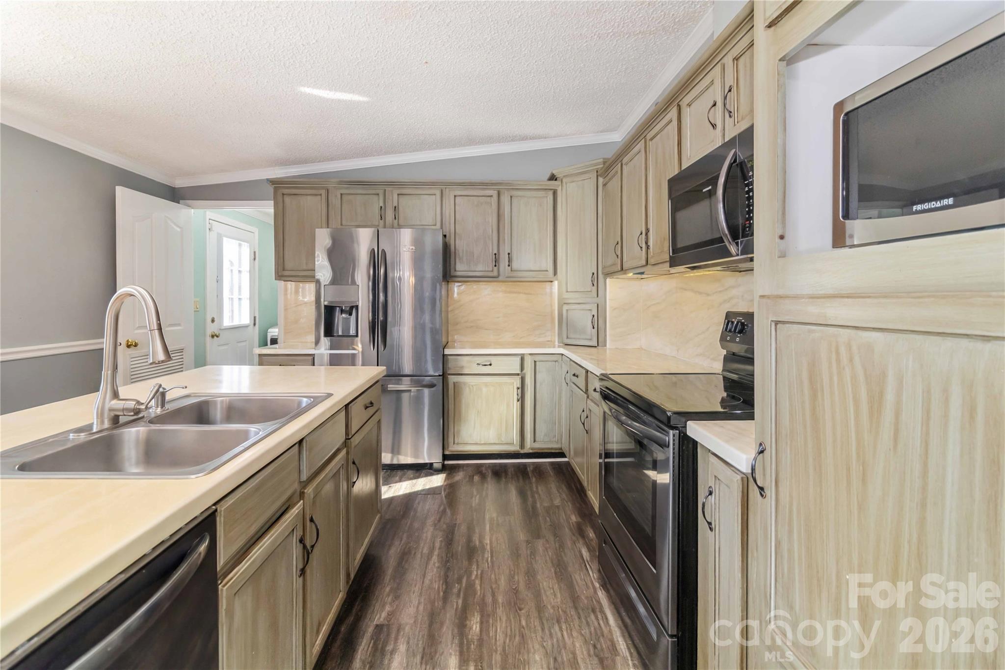 482 Pine Road Jefferson, SC 29718 - Photo 18 of 39 a kitchen with stainless steel appliances granite countertop a sink stove microwave and refrigerator