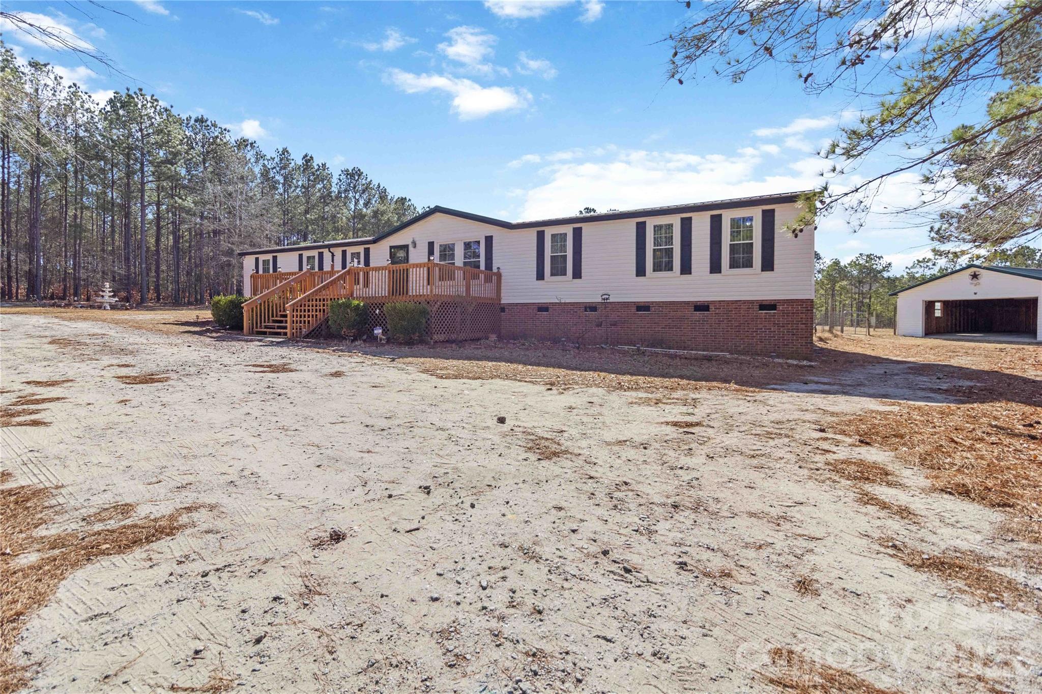 482 Pine Road Jefferson, SC 29718 - Photo 2 of 39 a front view of a house with a yard