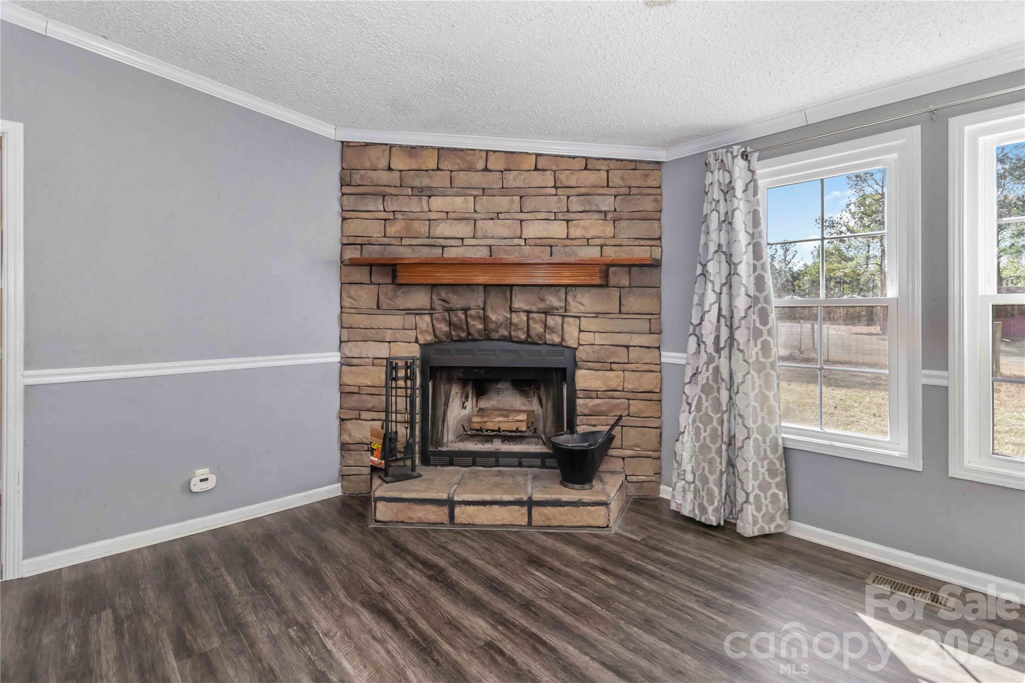 482 Pine Road Jefferson, SC 29718 - Photo 21 of 39 a living room with furniture and a fireplace