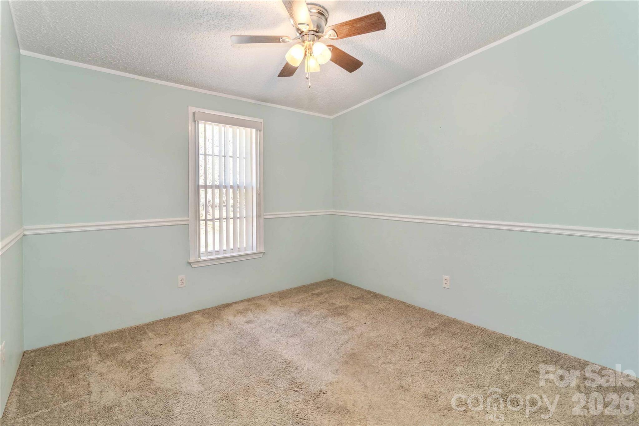 482 Pine Road Jefferson, SC 29718 - Photo 27 of 39 an empty room with windows and fan