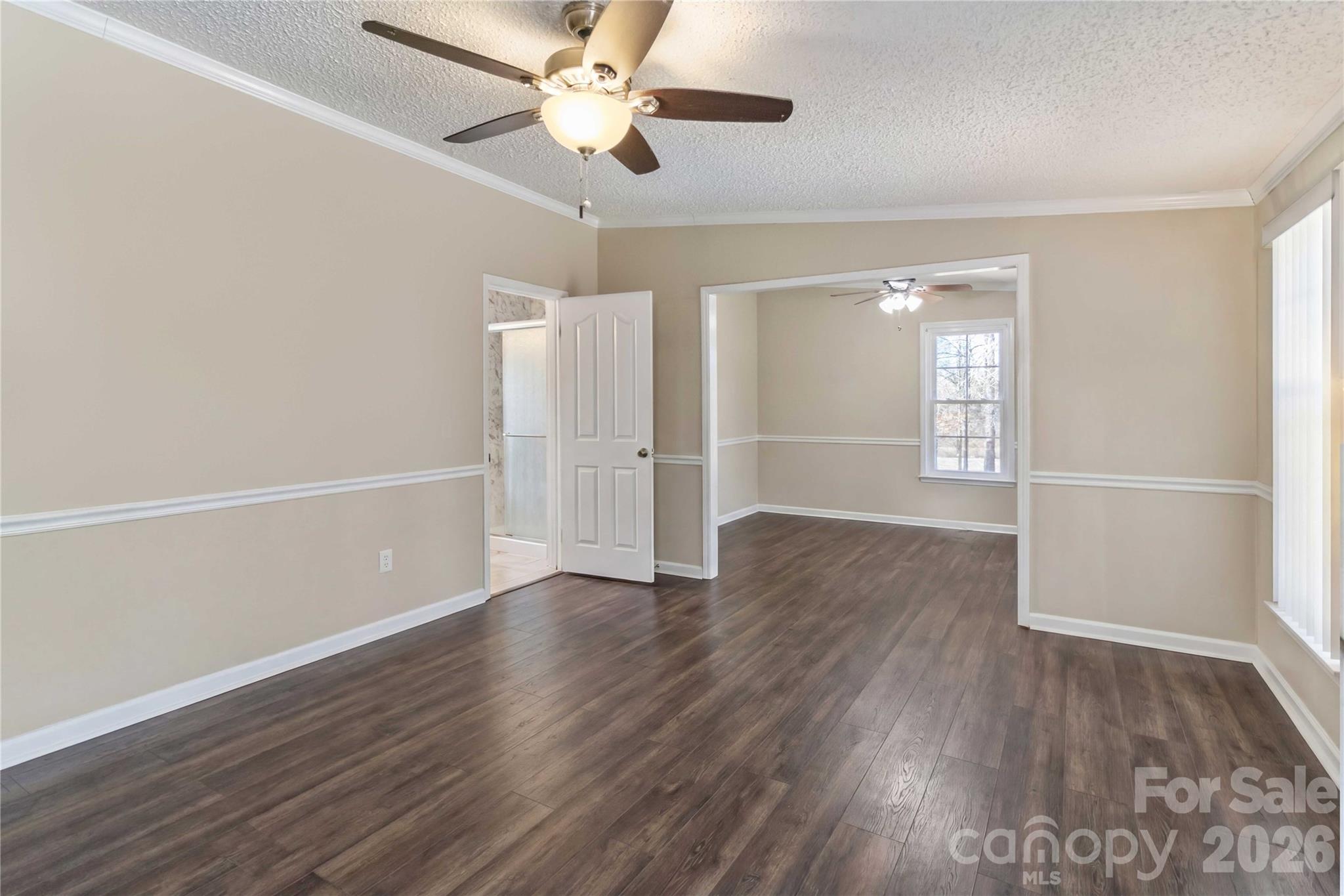 482 Pine Road Jefferson, SC 29718 - Photo 29 of 39 an empty room with wooden floor fan and windows