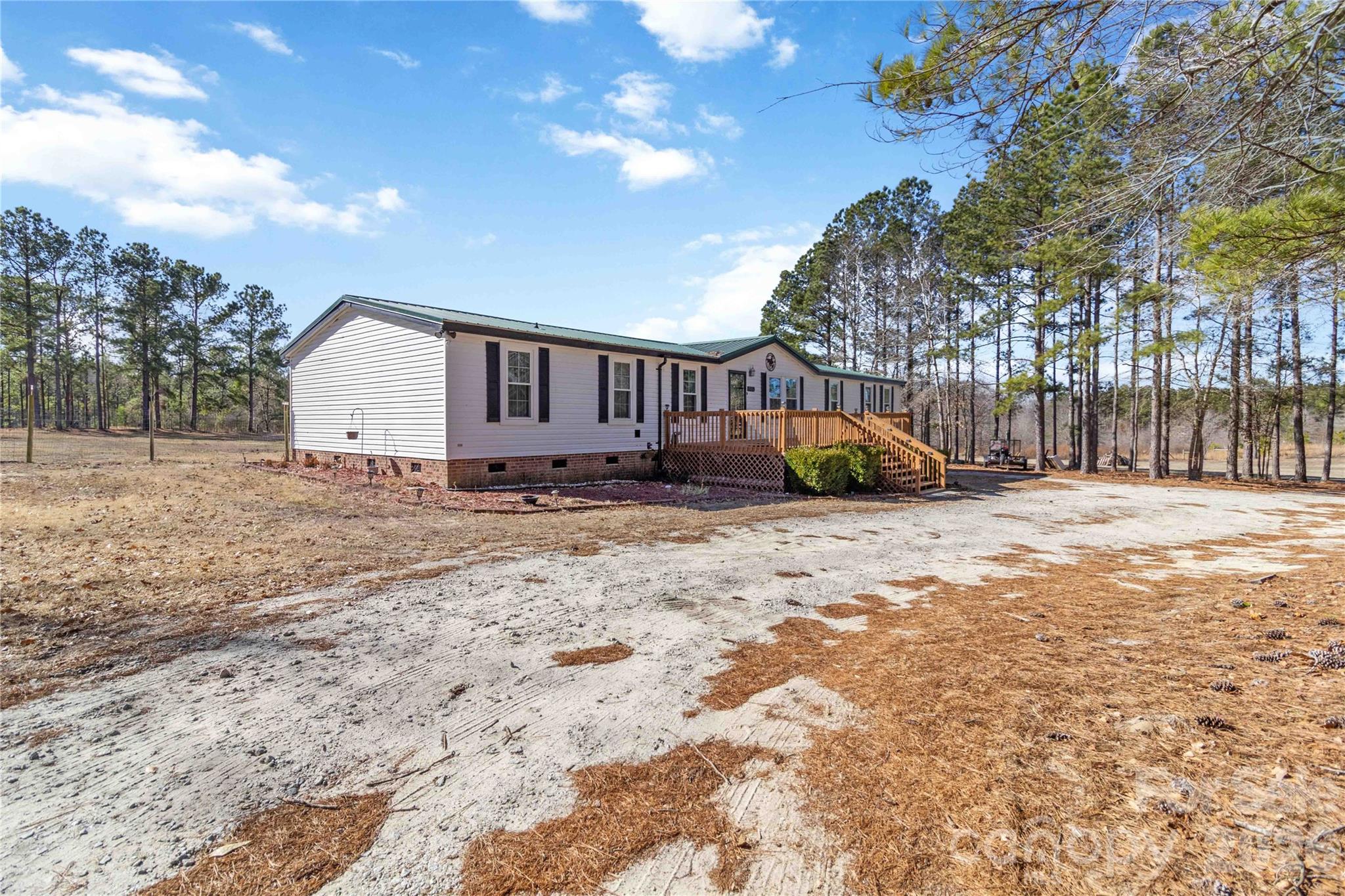 482 Pine Road Jefferson, SC 29718 - Photo 3 of 39 a view of a house with a yard
