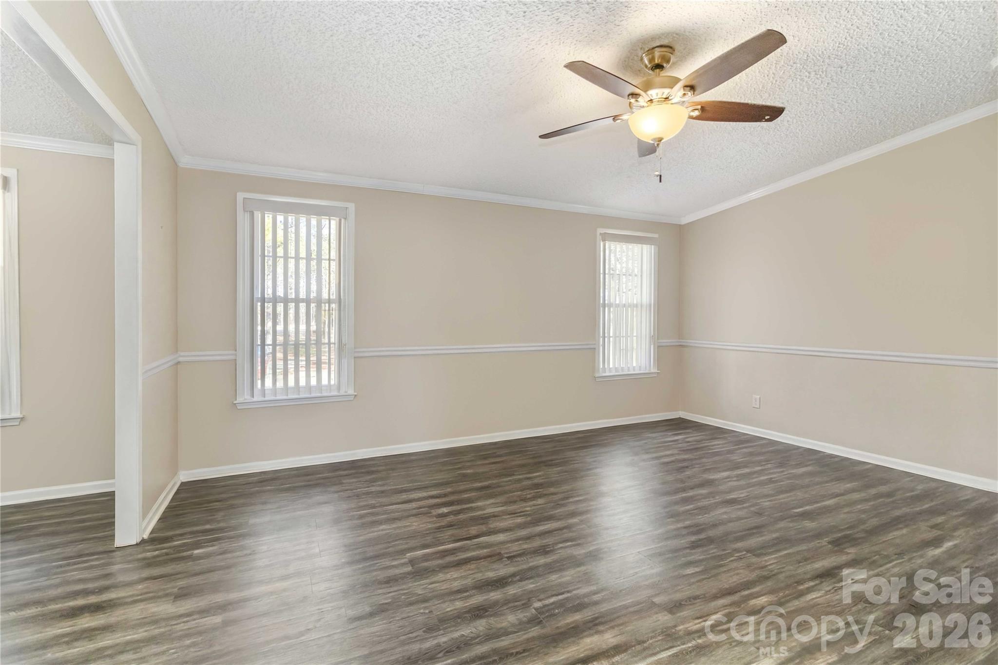 482 Pine Road Jefferson, SC 29718 - Photo 32 of 39 an empty room with wooden floor and windows
