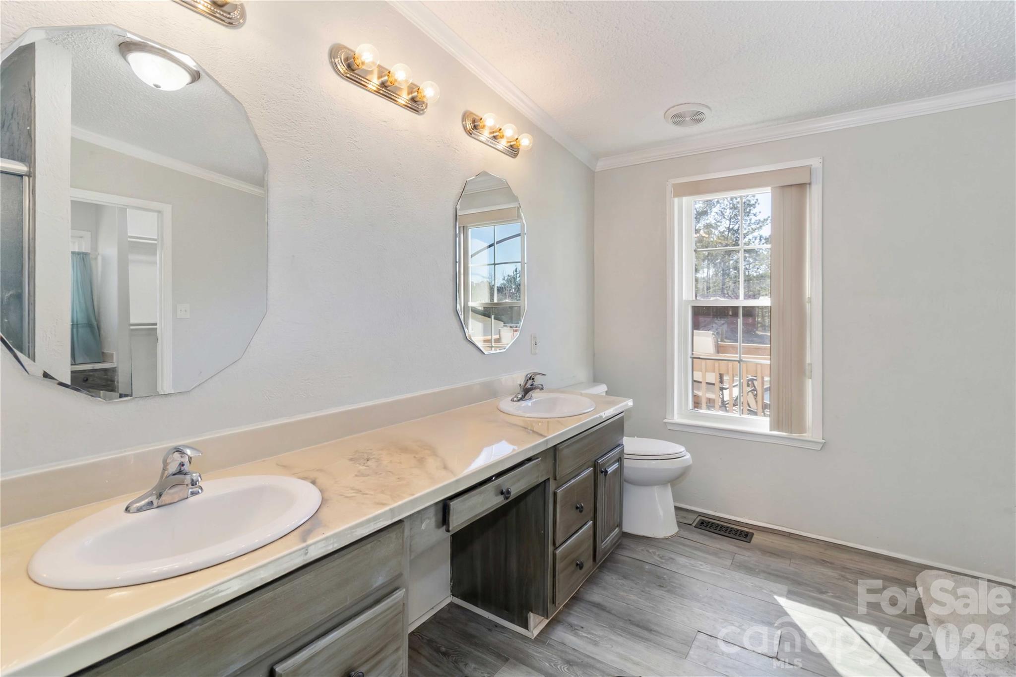 482 Pine Road Jefferson, SC 29718 - Photo 34 of 39 a bathroom with a double vanity sink and a mirror