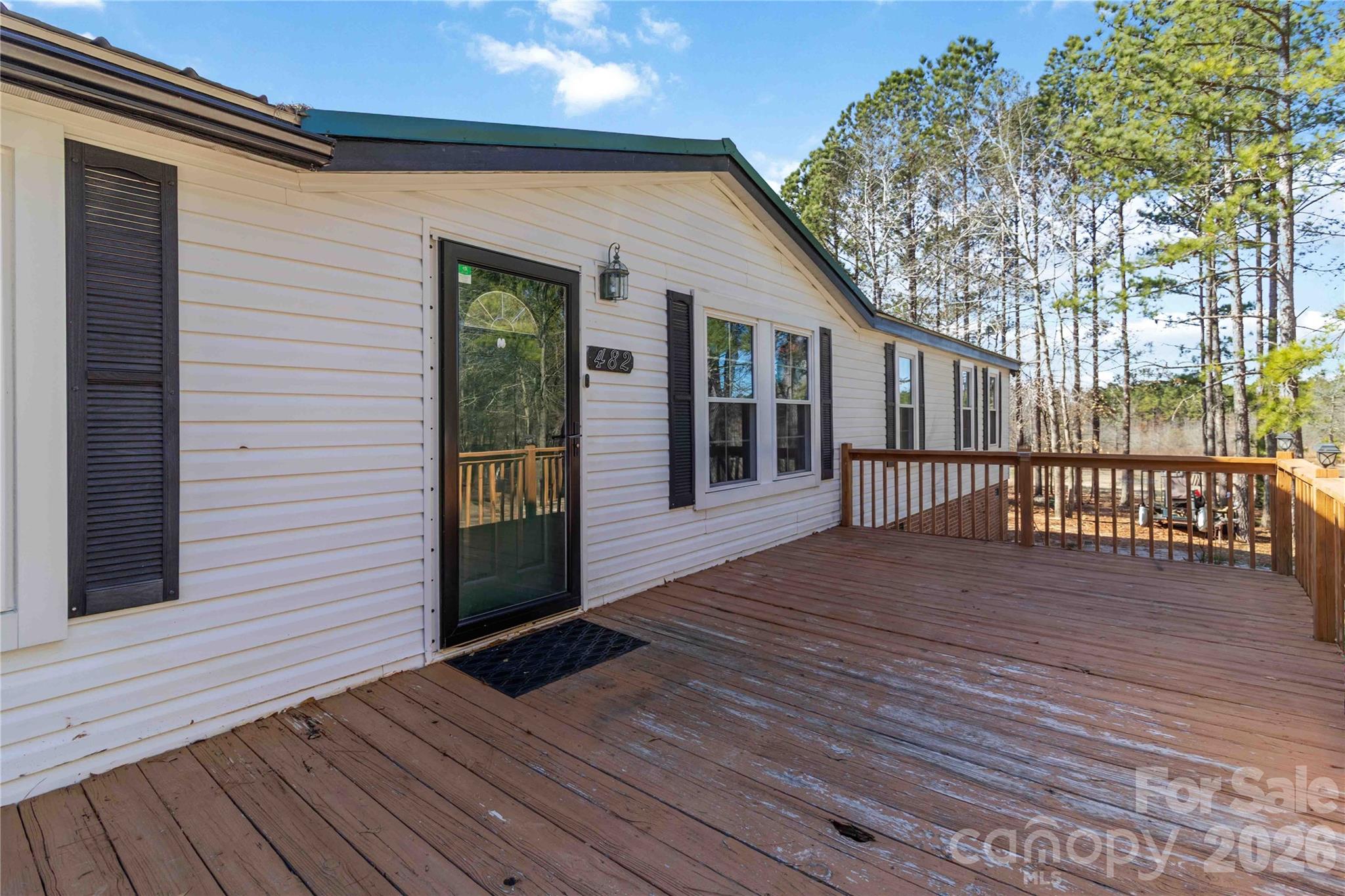 482 Pine Road Jefferson, SC 29718 - Photo 4 of 39 a view of a house with a deck