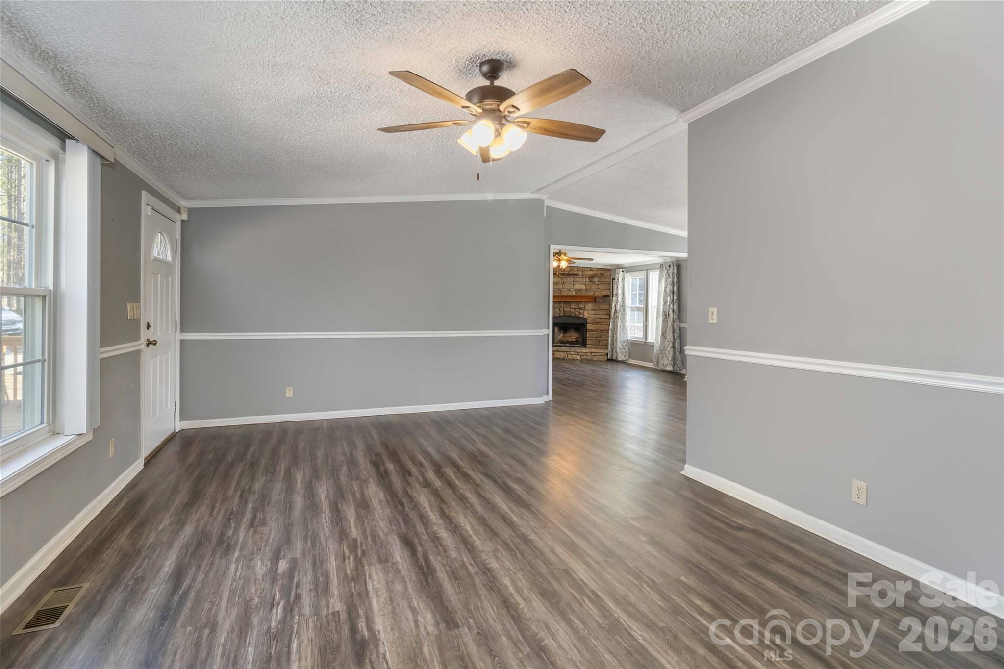 482 Pine Road Jefferson, SC 29718 - Photo 10 of 39 wooden floor in an empty room with a window