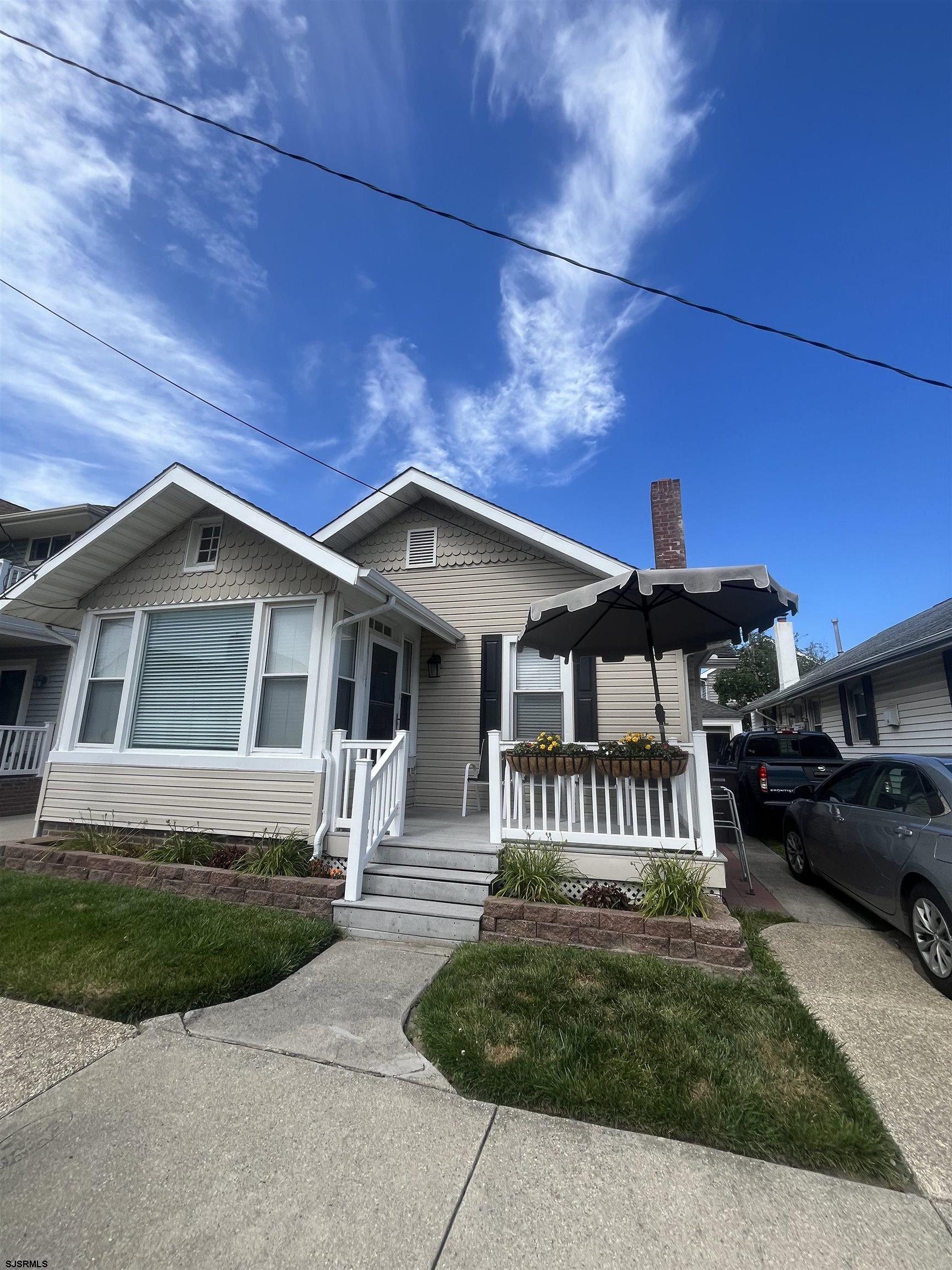 15 North Melbourne Avenue, Unit WINTER 2025 Ventnor City, NJ 08406 - Photo 1 of 15 a front view of a house with a yard