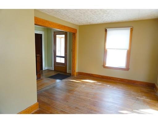12 North Brookfield Road Barre, MA 01005 - Photo 13 of 30 a view of an empty room with wooden floor and a window