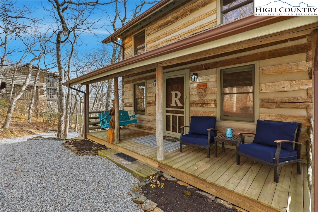 1411 Homestead Road Todd, NC 28684 - Photo 1 of 42 a view of a two chairs in the patio