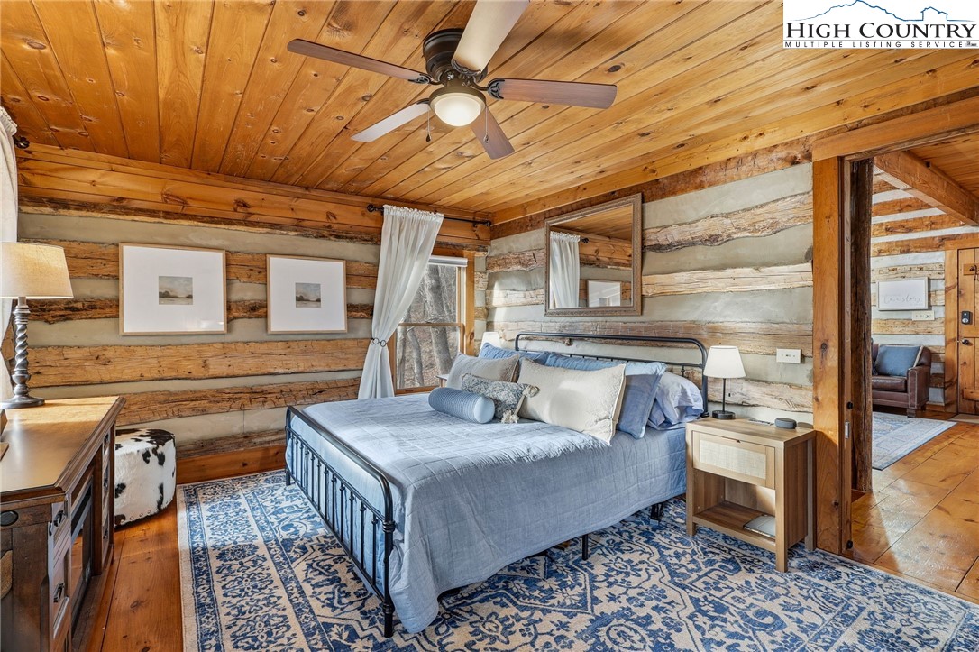 1411 Homestead Road Todd, NC 28684 - Photo 21 of 42 a bed room with a bed and a table