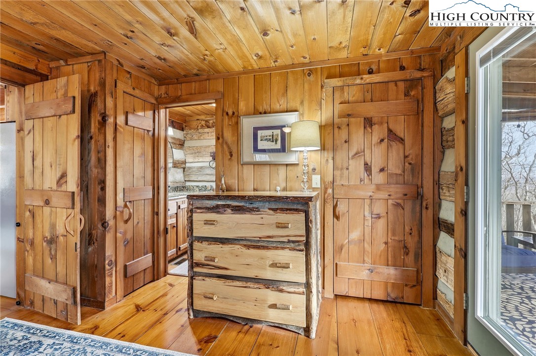 1411 Homestead Road Todd, NC 28684 - Photo 24 of 42 a view of walk in closet with wooden floor