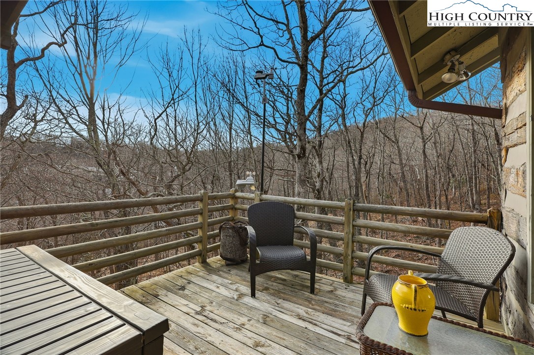 1411 Homestead Road Todd, NC 28684 - Photo 27 of 42 a view of patio with chairs and potted plants
