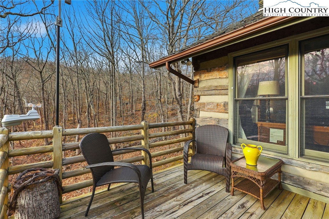 1411 Homestead Road Todd, NC 28684 - Photo 28 of 42 a backyard of a house with seating space