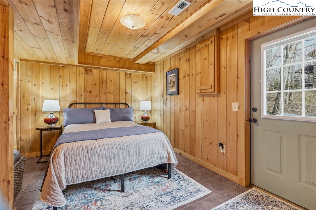 1411 Homestead Road Todd, NC 28684 - Photo 30 of 42 a bedroom with a bed and a window