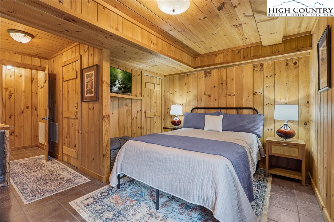 1411 Homestead Road Todd, NC 28684 - Photo 31 of 42 a bedroom with a bed and a table