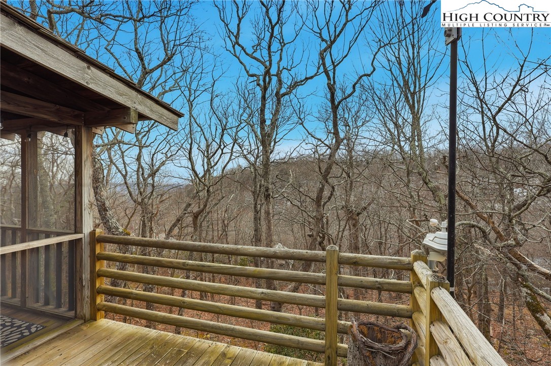 1411 Homestead Road Todd, NC 28684 - Photo 33 of 42 a view of backyard with wooden fence and large trees