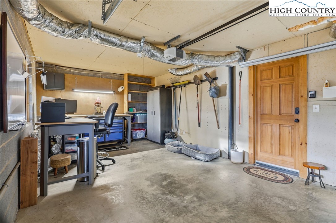 1411 Homestead Road Todd, NC 28684 - Photo 39 of 42 an empty room with windows