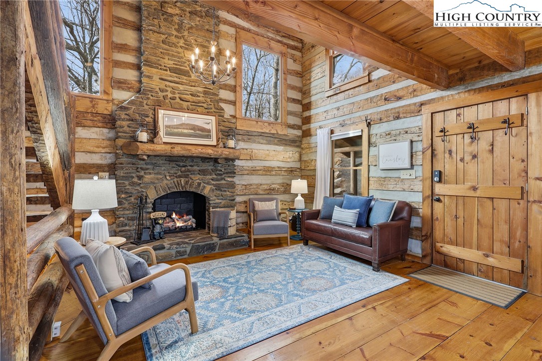 1411 Homestead Road Todd, NC 28684 - Photo 6 of 42 a living room with furniture and a fireplace