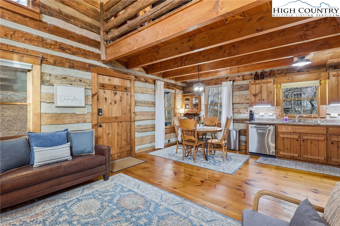 1411 Homestead Road Todd, NC 28684 - Photo 10 of 42 a living room with furniture and a view of kitchen