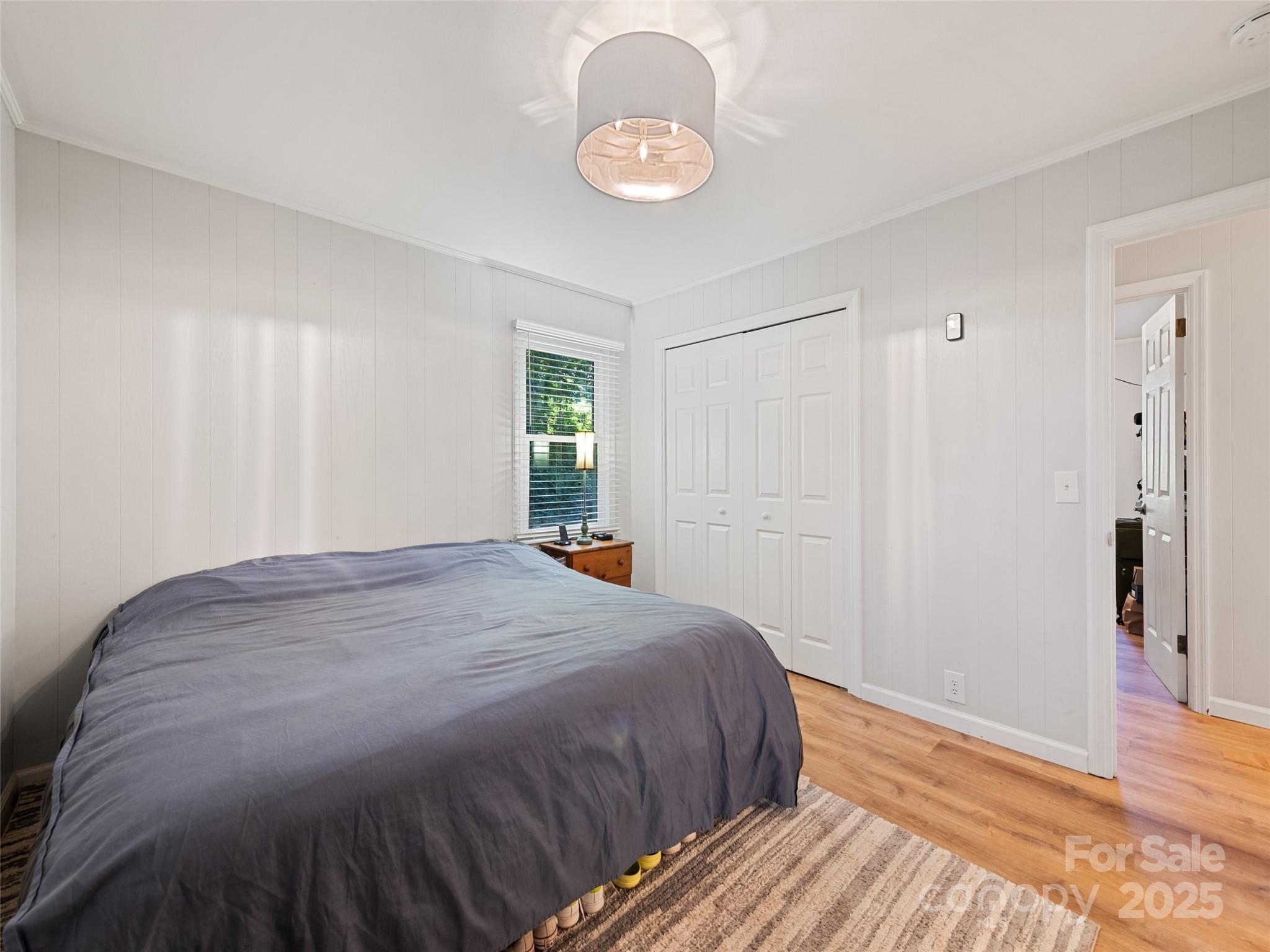 263 Blanton Street Columbus, NC 28722 - Photo 21 of 45 a bedroom with a bed and a window