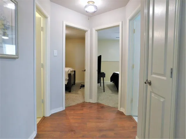a view of a bathroom from a hallway