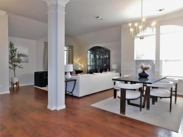 a view of a livingroom with furniture and a large window