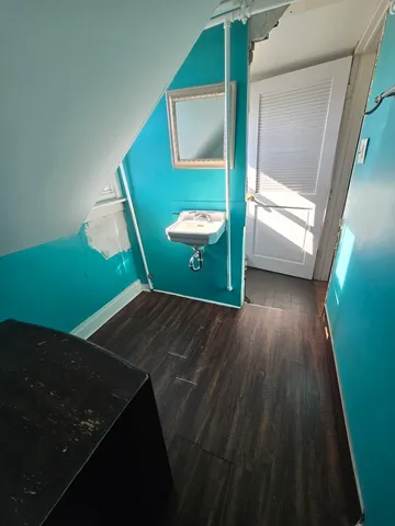 a living room with a chair and a table