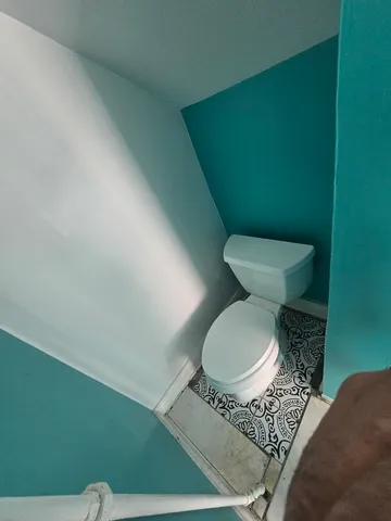 a bathroom with a toilet and a sink