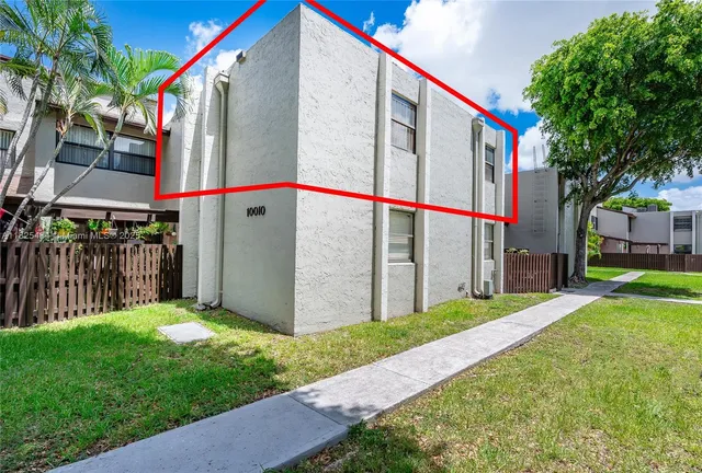 a view of a swimming pool with outdoor seating