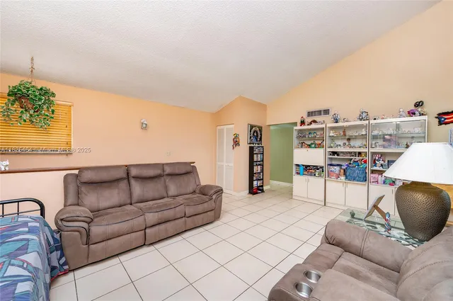 a living room with furniture and a table