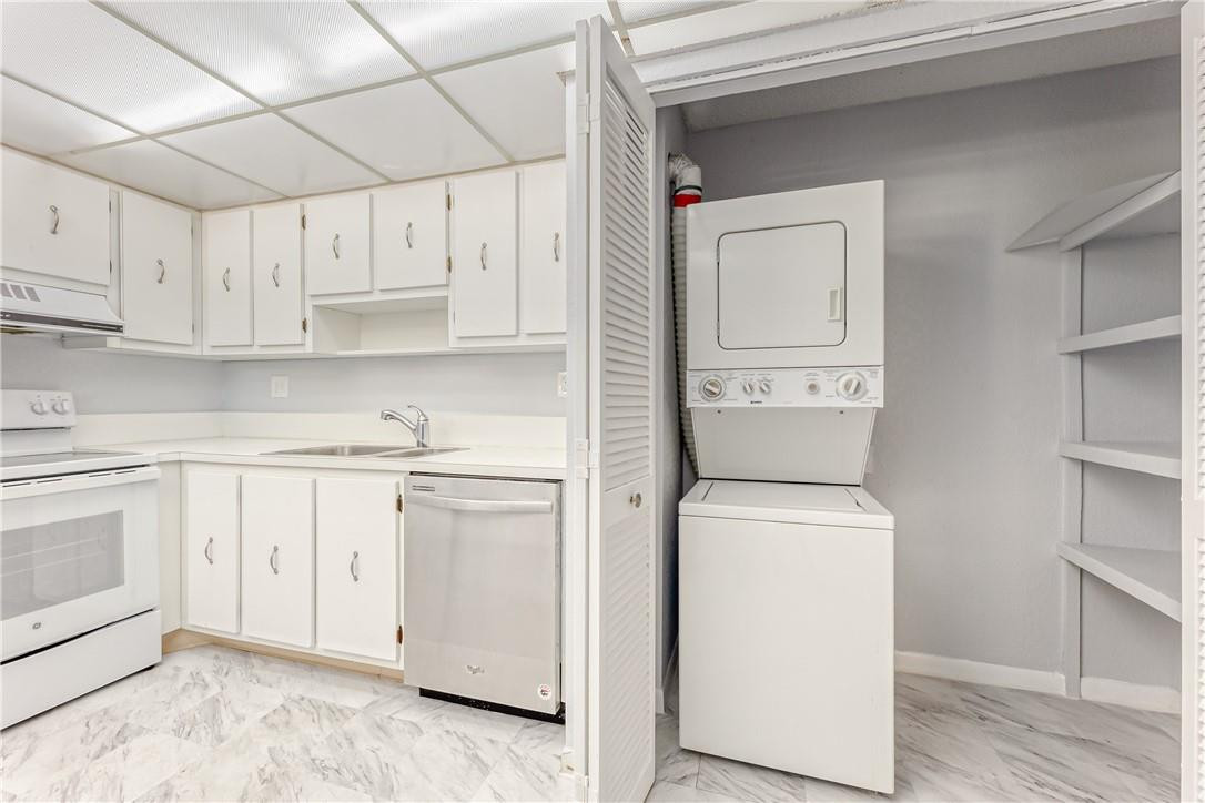 3900 Inverrary Boulevard, Unit E2 Lauderhill, FL 33319 - Photo 18 of 45 a utility room with dryer and washer