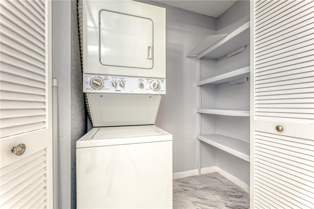 3900 Inverrary Boulevard, Unit E2 Lauderhill, FL 33319 - Photo 19 of 45 a utility room with dryer and washer