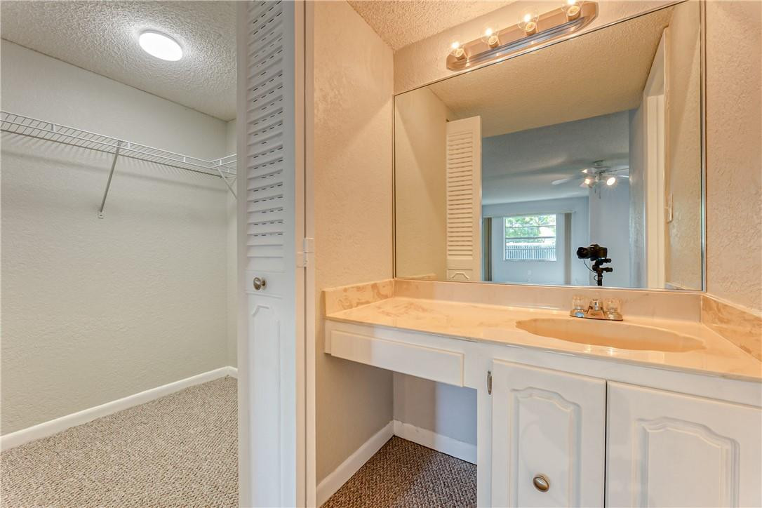 3900 Inverrary Boulevard, Unit E2 Lauderhill, FL 33319 - Photo 27 of 45 a bathroom with a sink and a mirror