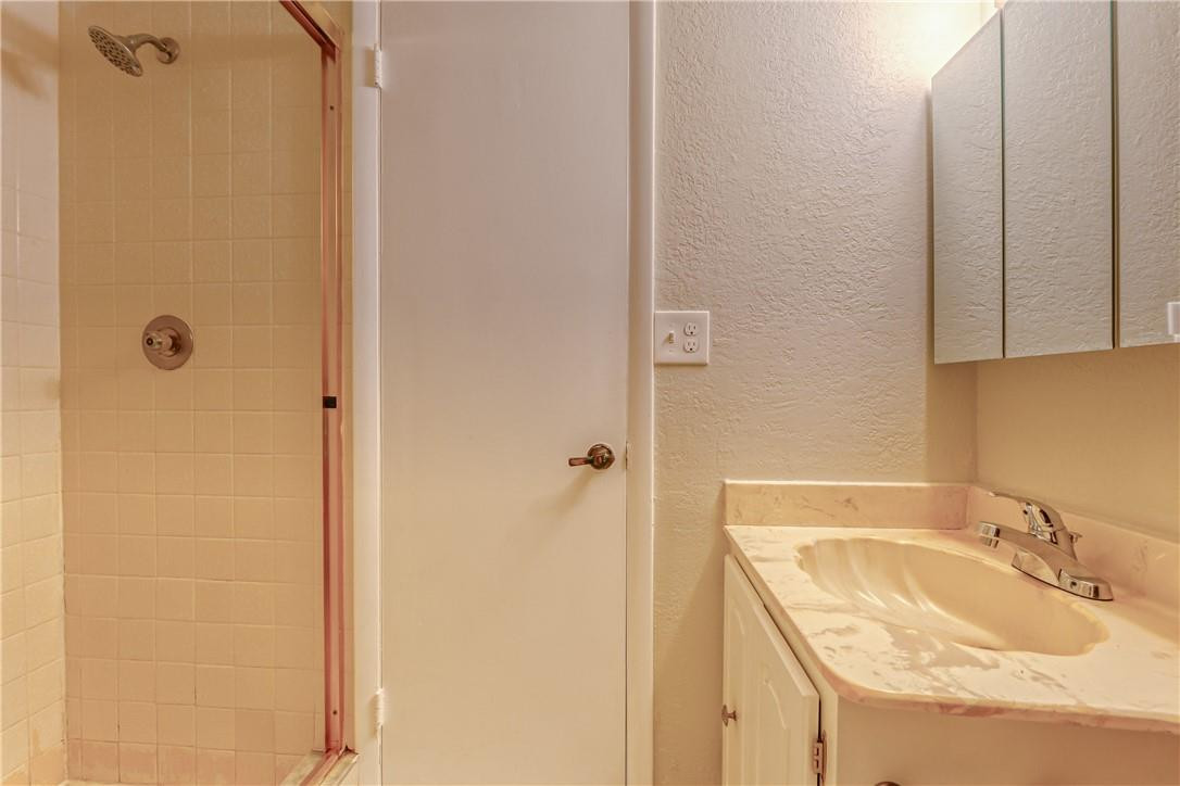 3900 Inverrary Boulevard, Unit E2 Lauderhill, FL 33319 - Photo 29 of 45 a bathroom with a sink and shower