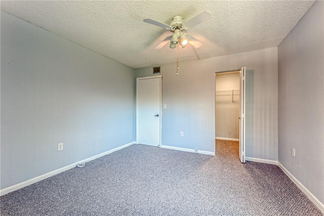 3900 Inverrary Boulevard, Unit E2 Lauderhill, FL 33319 - Photo 33 of 45 an empty room with chandelier fan