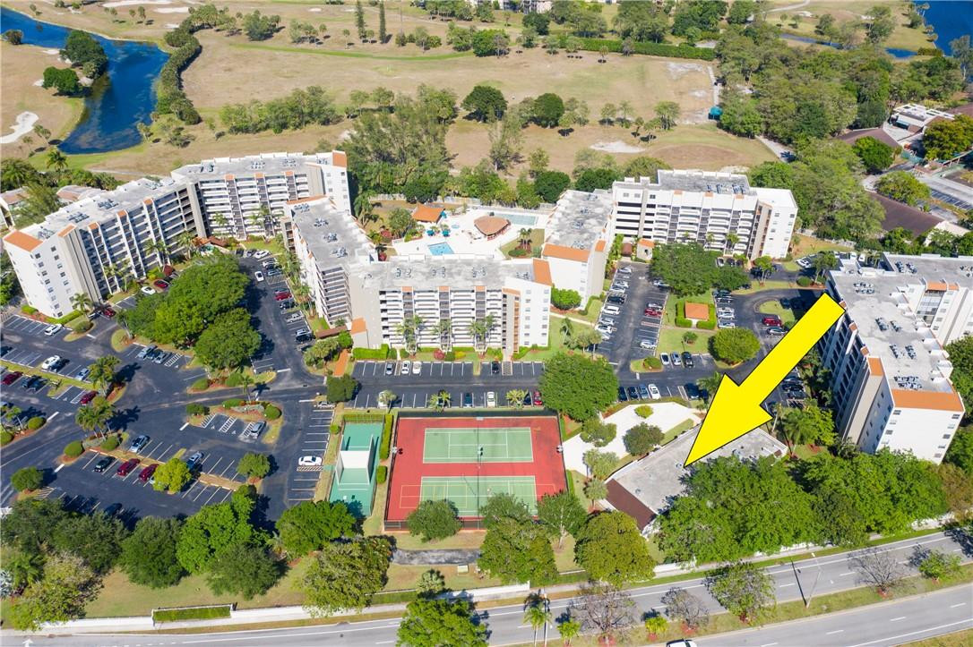 3900 Inverrary Boulevard, Unit E2 Lauderhill, FL 33319 - Photo 44 of 45 a view of swimming pool with a yard and outdoor seating