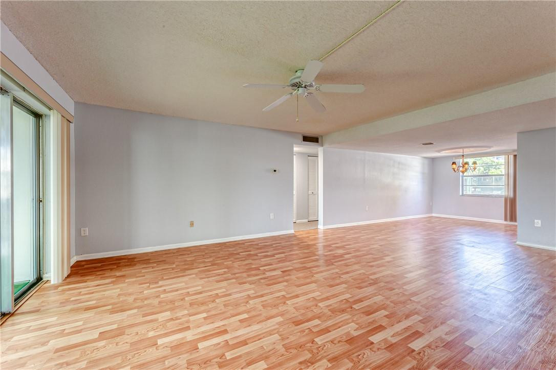 3900 Inverrary Boulevard, Unit E2 Lauderhill, FL 33319 - Photo 8 of 45 a view of empty room with wooden floor and fan