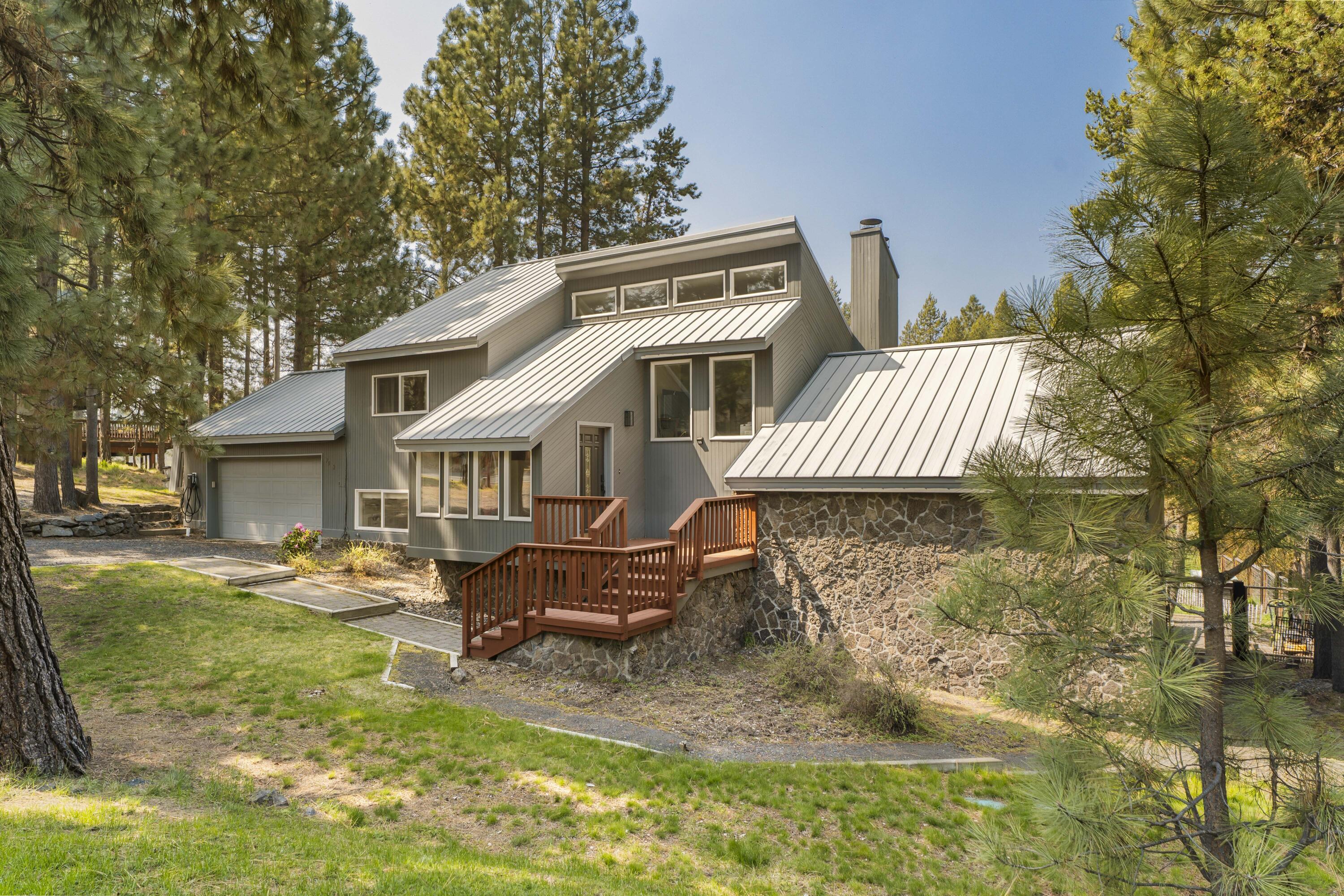 17062 Milky Way Bend, OR 97707 - Photo 6 of 39 Contemporary chalet with stone foundation, standing-seam metal roof, and clerestory windows