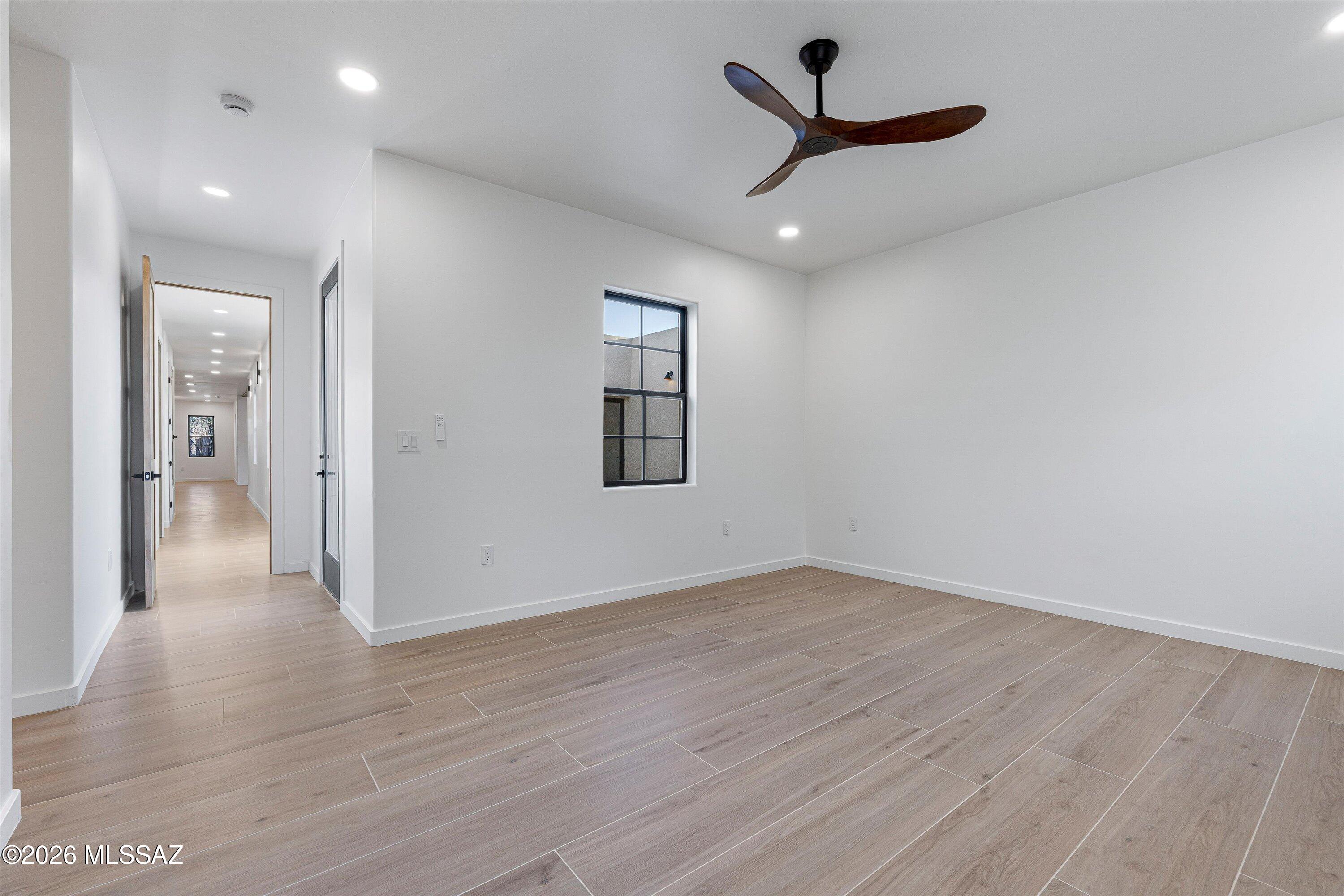 5259 East Fort Lowell Road Tucson, AZ 85712 - Photo 21 of 50 wooden floor in an empty room with a window