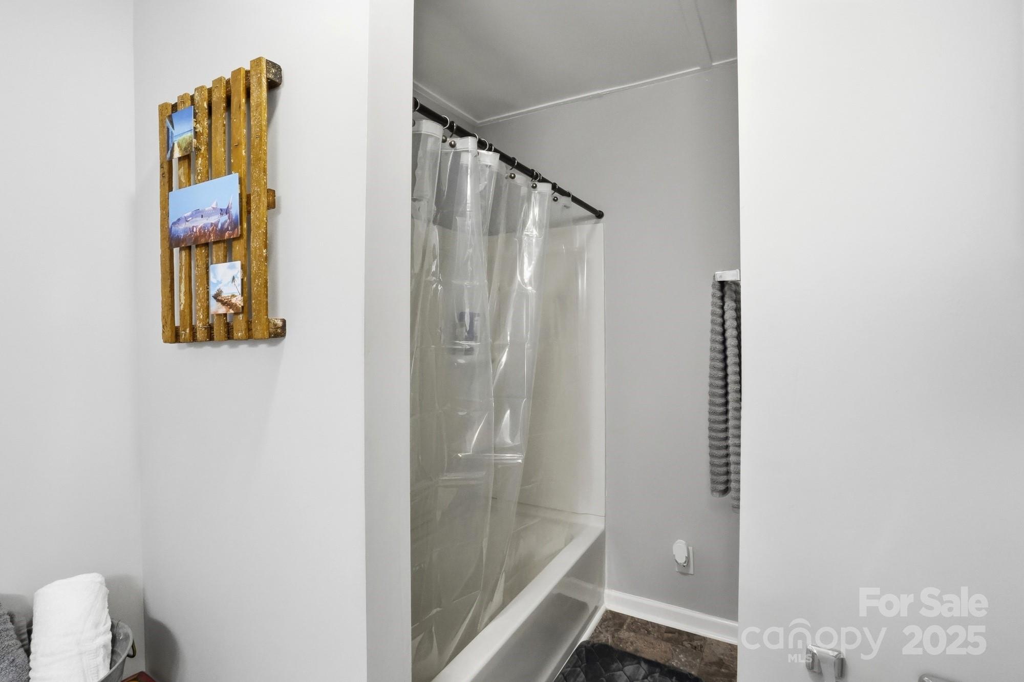 910 Roosevelt Street Badin, NC 28001 - Photo 16 of 30 a bathroom with a shower and a sink
