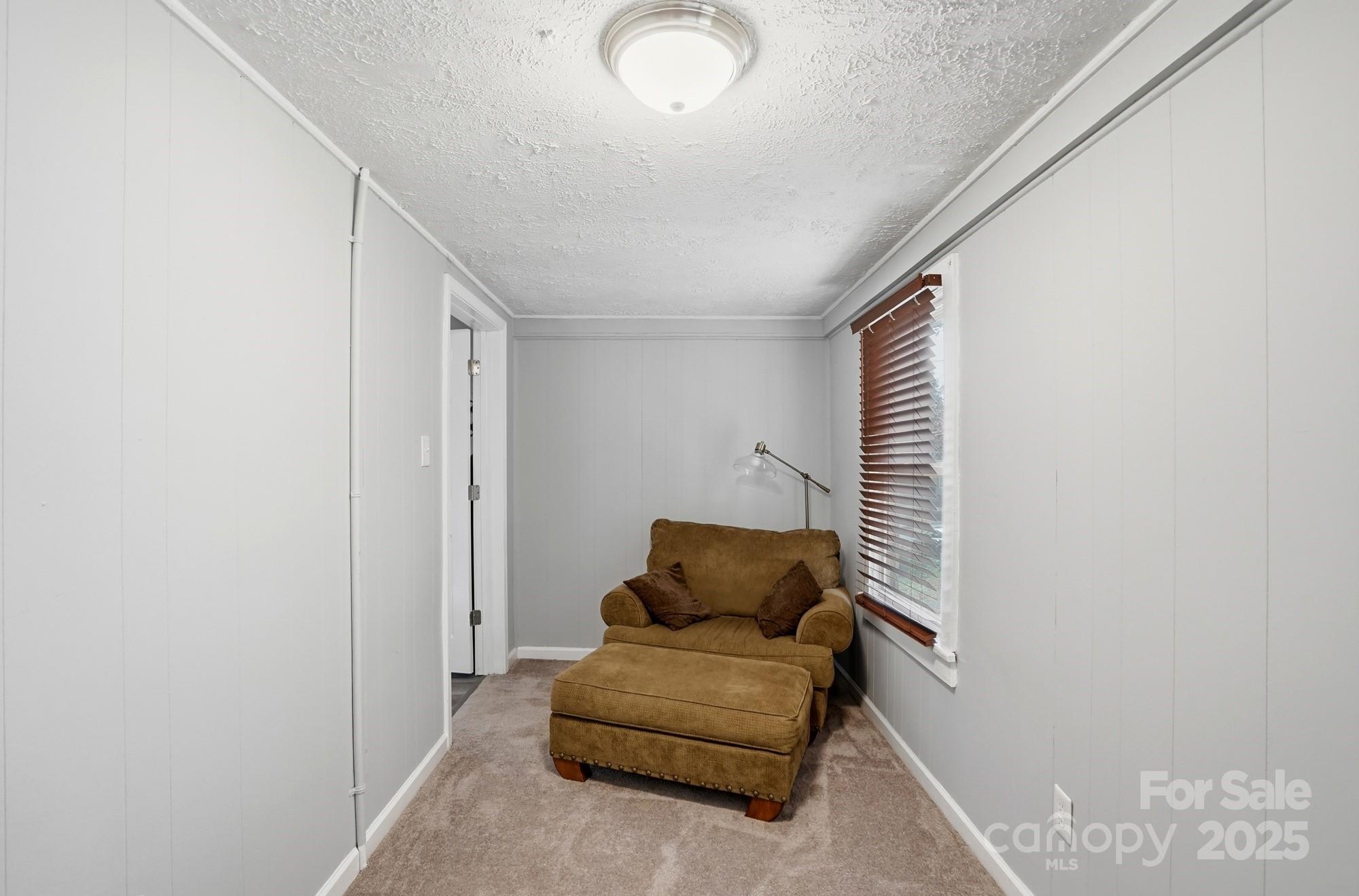 910 Roosevelt Street Badin, NC 28001 - Photo 26 of 30 a living room with furniture and a window