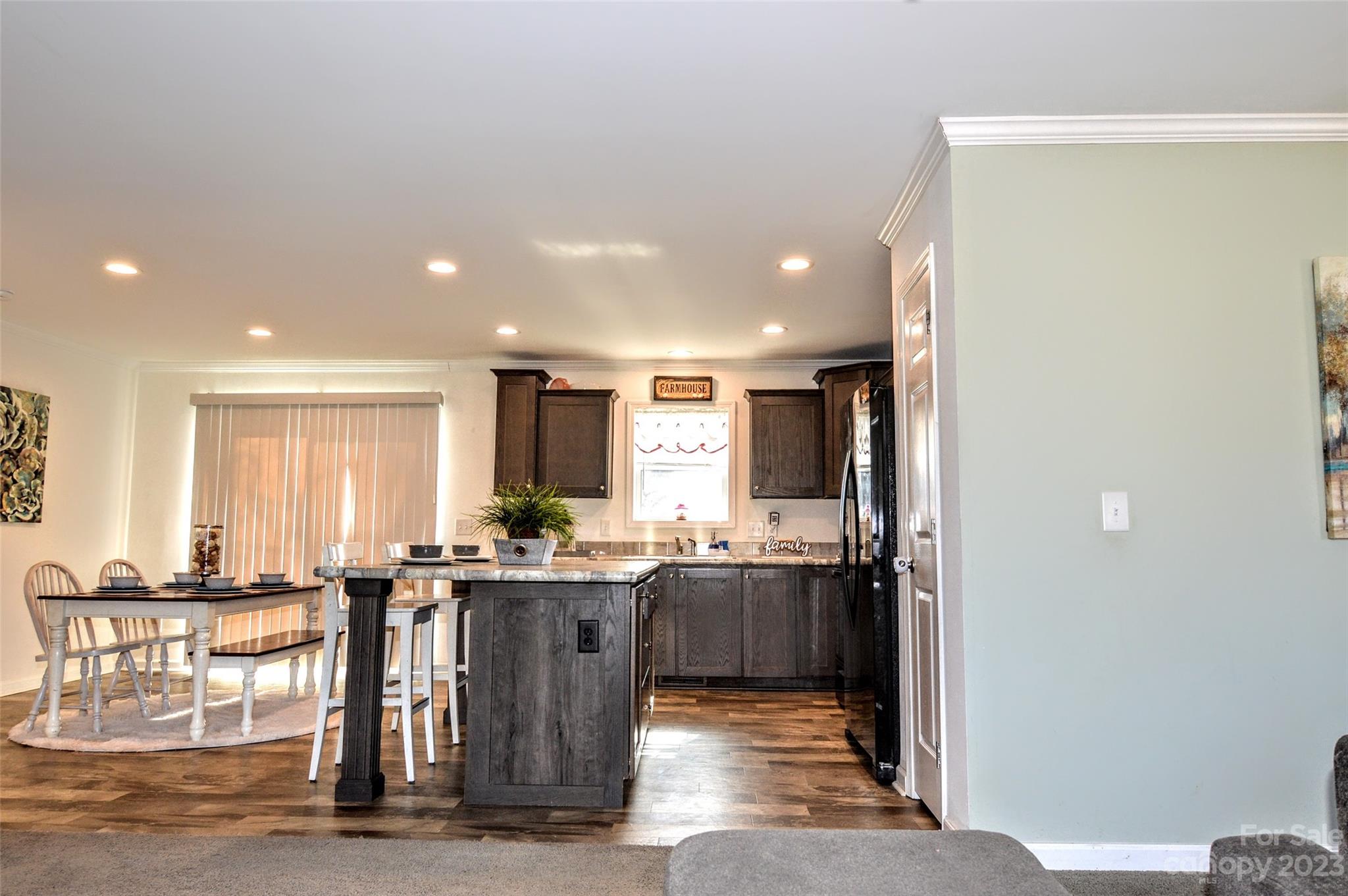 5717 Griffith Road Monroe, NC 28112 - Photo 11 of 48 a kitchen with stainless steel appliances a sink stove and cabinets
